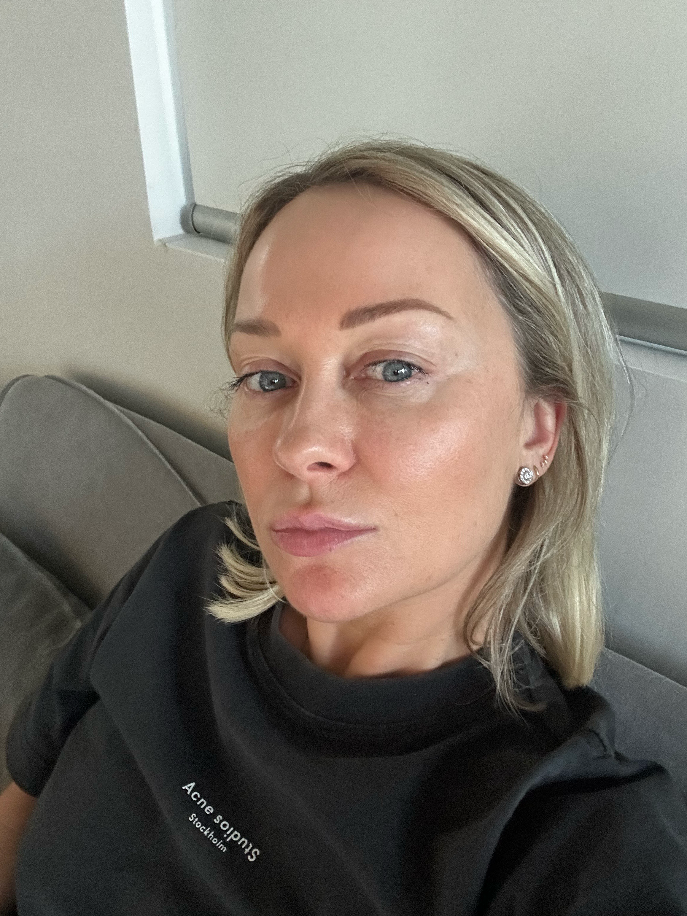 Ms. Lova founder wearing Face Tan Water showing a natural, makeup-free glow at home